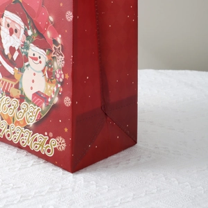 Red Christmas non-woven gift bag with Santa Claus and Snowman prints and side gusset
