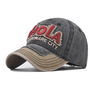 Close-up of vintage washed baseball cap with 3D HOLA embroidery and contrast peak