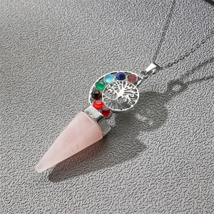Vintage Tree of Life pendant with teardrop pink crystal and chakra stones on grey background