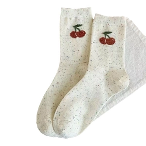 Off-white crew socks with cherry embroidery and colorful knit specks for women