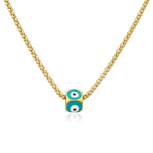Golden double chain necklace with evil eye enamel cube pendant on white surface