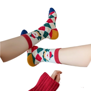 Festive Christmas knit socks with Santa Claus pattern and classic diamond lattice design