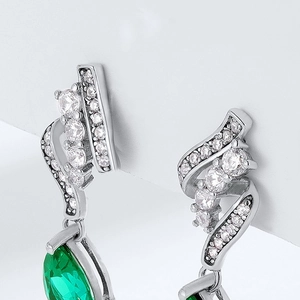 S925 sterling silver drop earrings with emerald-cut stones and wavy diamond inlay