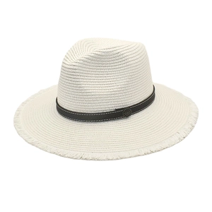 Detail view of frayed edges on a white straw fedora with black band and metal buckle