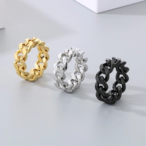 Detailed view of punk style cuban link rings in gold silver and black finishes