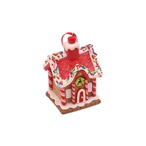Detail von Weihnachts Lebkuchenhaus Dekoration mit rotem Glitzerdach und Zuckerstangen Säulen