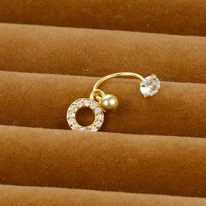 Macro shot of gold-plated flower belly ring with clear cubic zirconia on a velvet display tray