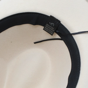 Detail view of the inner sweatband and material care label showing 65% cotton blend