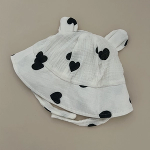 Cute baby cotton gauze bucket hat featuring black heart pattern and decorative ears