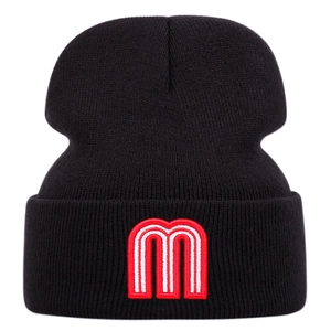Close-up of black beanie featuring a 3D embroidered red and white letter M logo