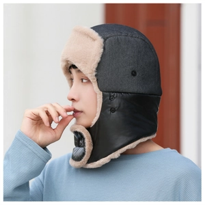 Detail of warm winter trapper hat with fleece lining and windproof ear flaps for men