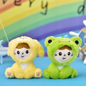 Detail view of two cute plush doll pendants in yellow dog and green frog costumes