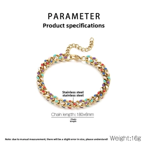 Detailed view of golden stainless steel Cuban chain bracelet with colorful enamel dots