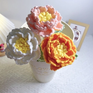 Handmade crochet peony bouquet with pink, white and orange yarn flowers for home decor