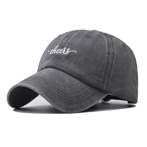Detailed embroidery of white cheers text on a washed grey cotton baseball cap