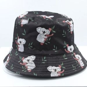 Detail of cartoon koala and leaf print on black reversible bucket hat fabric