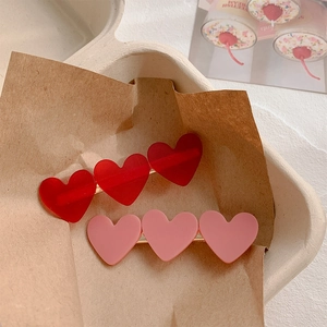Cute red and pink heart hair clips with matte finish and golden duckbill metal base