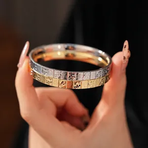 Gold and silver minimalist bangle bracelets with engraved Mahjong characters on metal