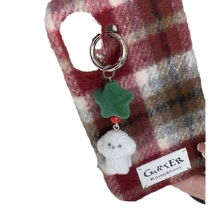 Red plaid phone case with green velvet star and white plush puppy charm hanging