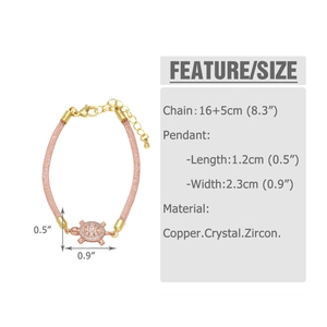 Detailed view of turtle bracelet with crystal stones and pink braided strap
