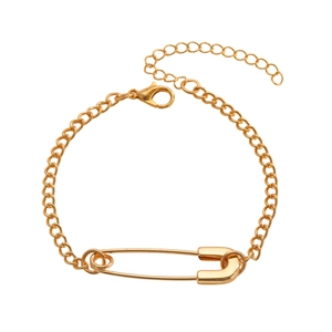 Detail view of a gold safety pin bracelet with lobster clasp and adjustable link chain