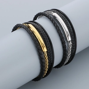 Close-up of multi-layer woven leather bracelet with magnetic gold and silver clasp