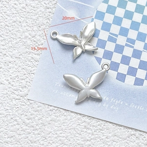 Macro view of matte silver butterfly pendant for DIY jewelry with 20mm x 15.5mm dimensions