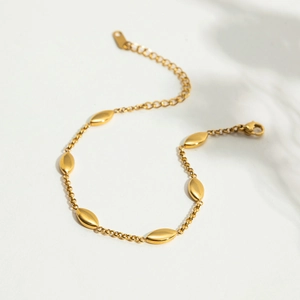 Detail of 18K gold stainless steel bracelet with marquise beads and adjustable clasp