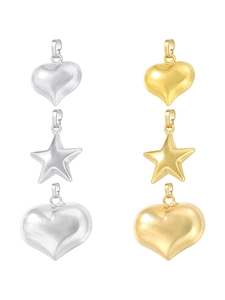 Detailed view of heart and star shaped gold and silver pendants in multiple sizes
