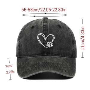 Detail view of washed cotton baseball cap showing heart embroidery and size dimensions