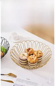 Close-up of a luxury gold iron fruit basket used as a stylish cupcake serving tray