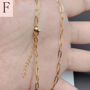 Detailed view of 18K gold plated paperclip chain with lobster clasp and extender