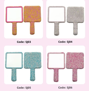 Detail of square handheld mirrors with sparkling rhinestones in four vibrant colors