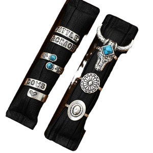 Vintage silver western ring set with turquoise elements and engraved cattle motifs