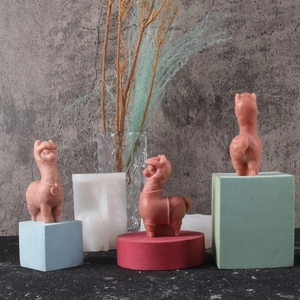Detail of 3D alpaca silicone mold showing textured candle results on colorful bases