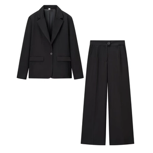 Women's two-piece black formal suit featuring a single-breasted blazer and wide-leg trousers