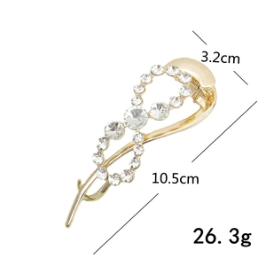 Golden twist banana hair clip with crystals, 10.5cm length and 3.2cm width dimensions