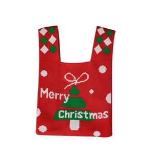 Red knitted Christmas apple gift bag with Merry Christmas text and tree pattern