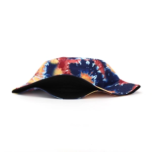 Detail of tie-dye bucket hat showing vibrant blue and orange patterns and black lining