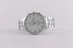 Detail of silver Orlando quartz watch showing white dial with triple sub-dial design