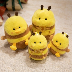Cute plush bee duck toy set with yellow fur and $ emblem for bags and keychains