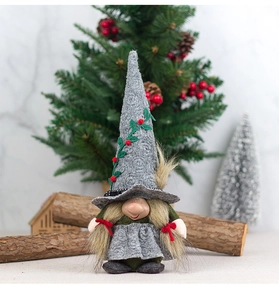 Detailed Christmas gnome plush with grey hat and red berry embroidery in festive setting