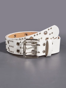 Detail of white double-grommet punk belt with silver metal eyelets and rivets on grey base