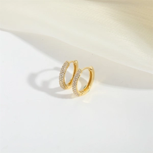 Elegant gold hoop earrings featuring three rows of pave-set sparkling cubic zirconia crystals