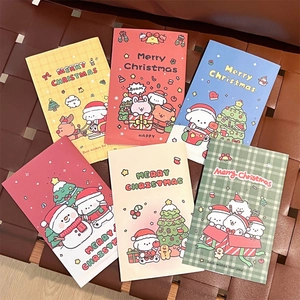 Flat lay of Christmas greeting cards with cartoon reindeer and snowmen designs