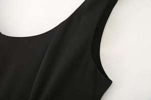 Detailed macro view of the black square neck midi dress showing smooth fabric texture