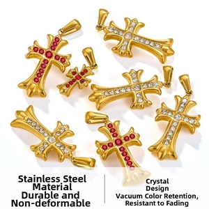 Macro detail of gothic stainless steel cross pendants with red and white crystals