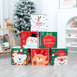 Stack of festive Christmas gift boxes with reindeer and snowman prints for tree decoration
