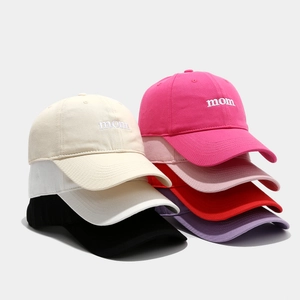 Detail view of cotton baseball caps with mom embroidery in seven various colors