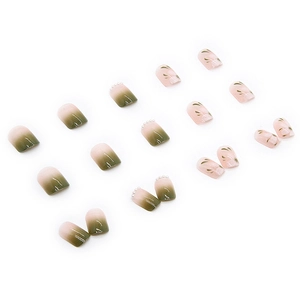 Press-on nails featuring green gradient, pearl accents and camellia floral leaf patterns